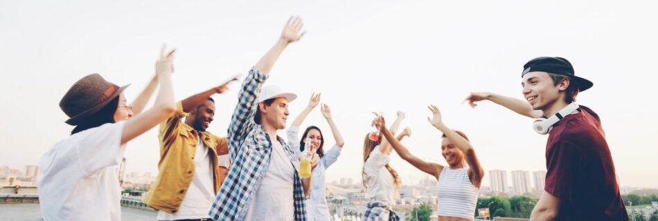 young friends celebrating at rooftop party